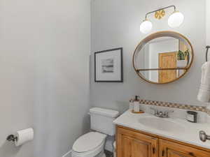 Bathroom with toilet and vanity