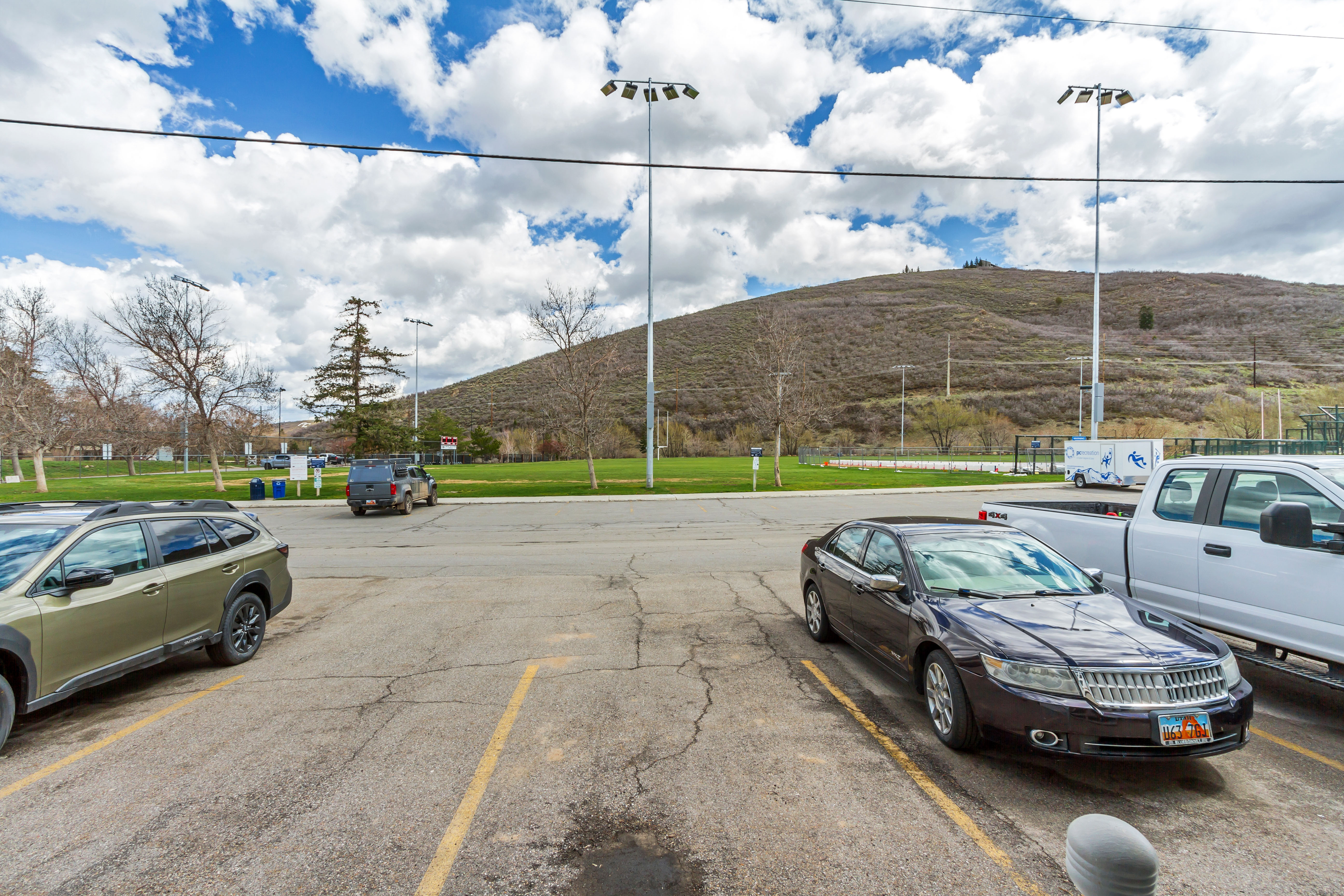 View of asphalt street featuring a mountain view