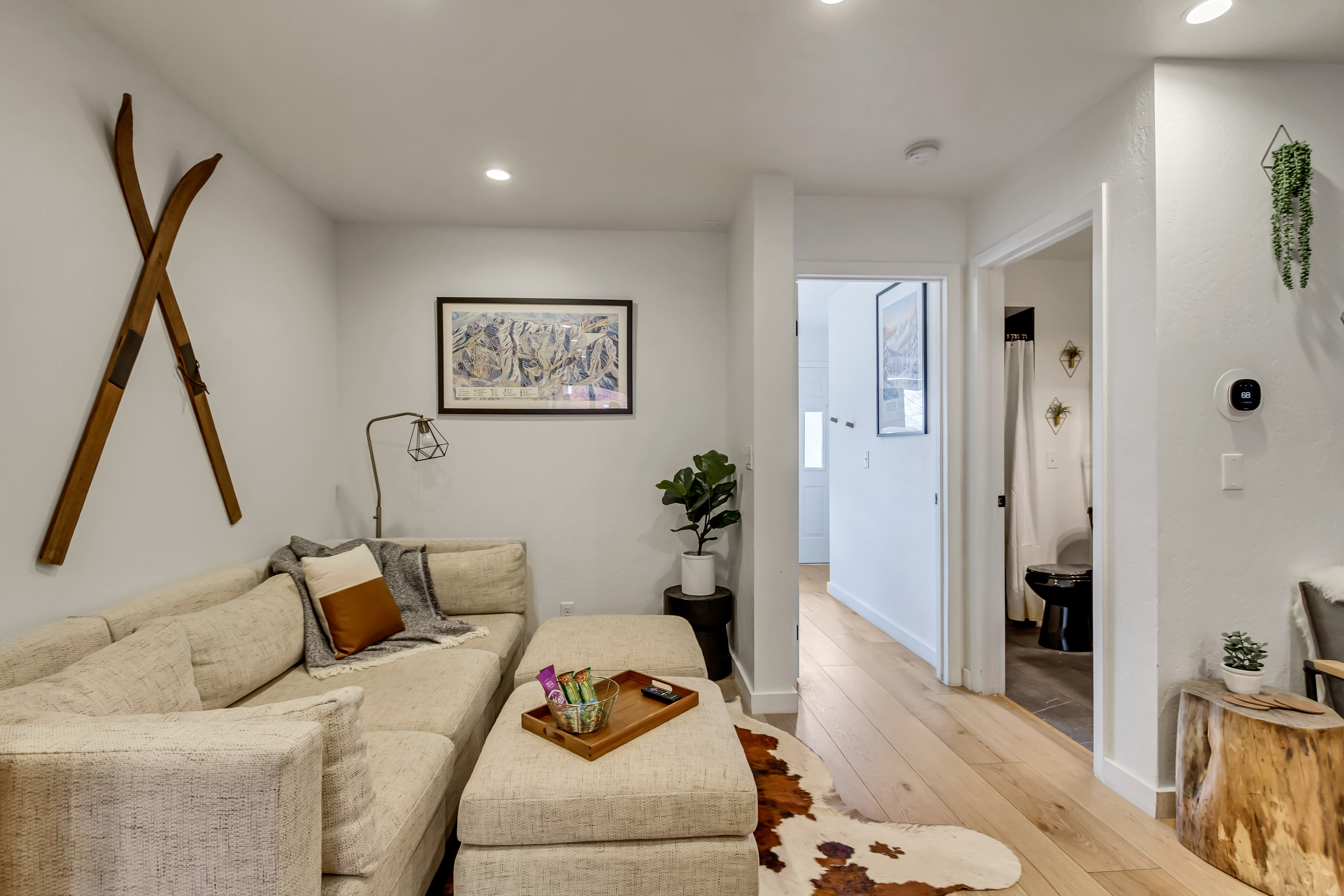Living room with light wood-style floors and recessed lighting
