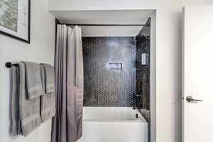 Full bath featuring shower / bathtub combination with curtain