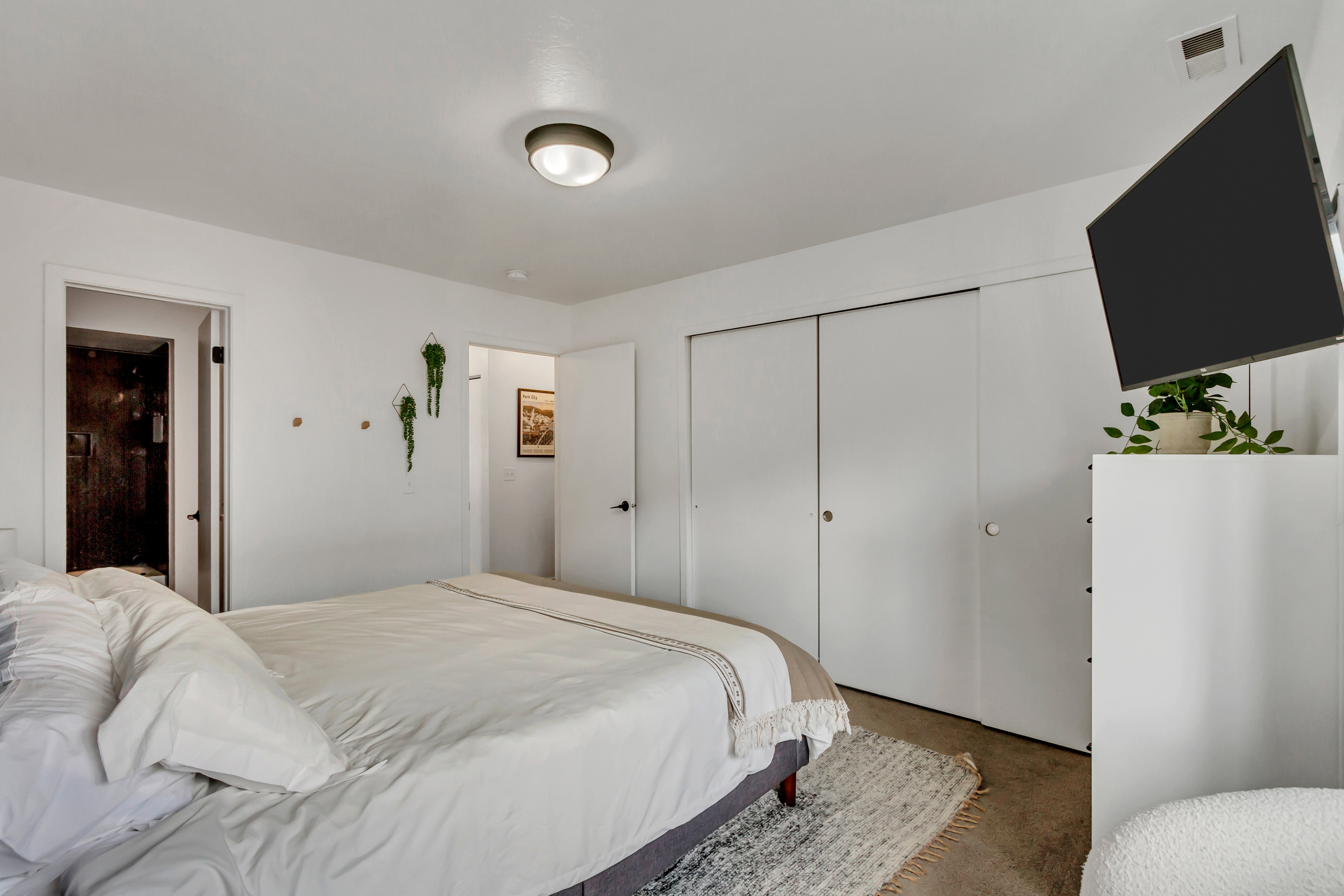 Bedroom featuring a closet and ensuite bathroom