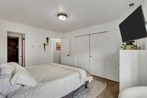 Bedroom featuring a closet and ensuite bathroom