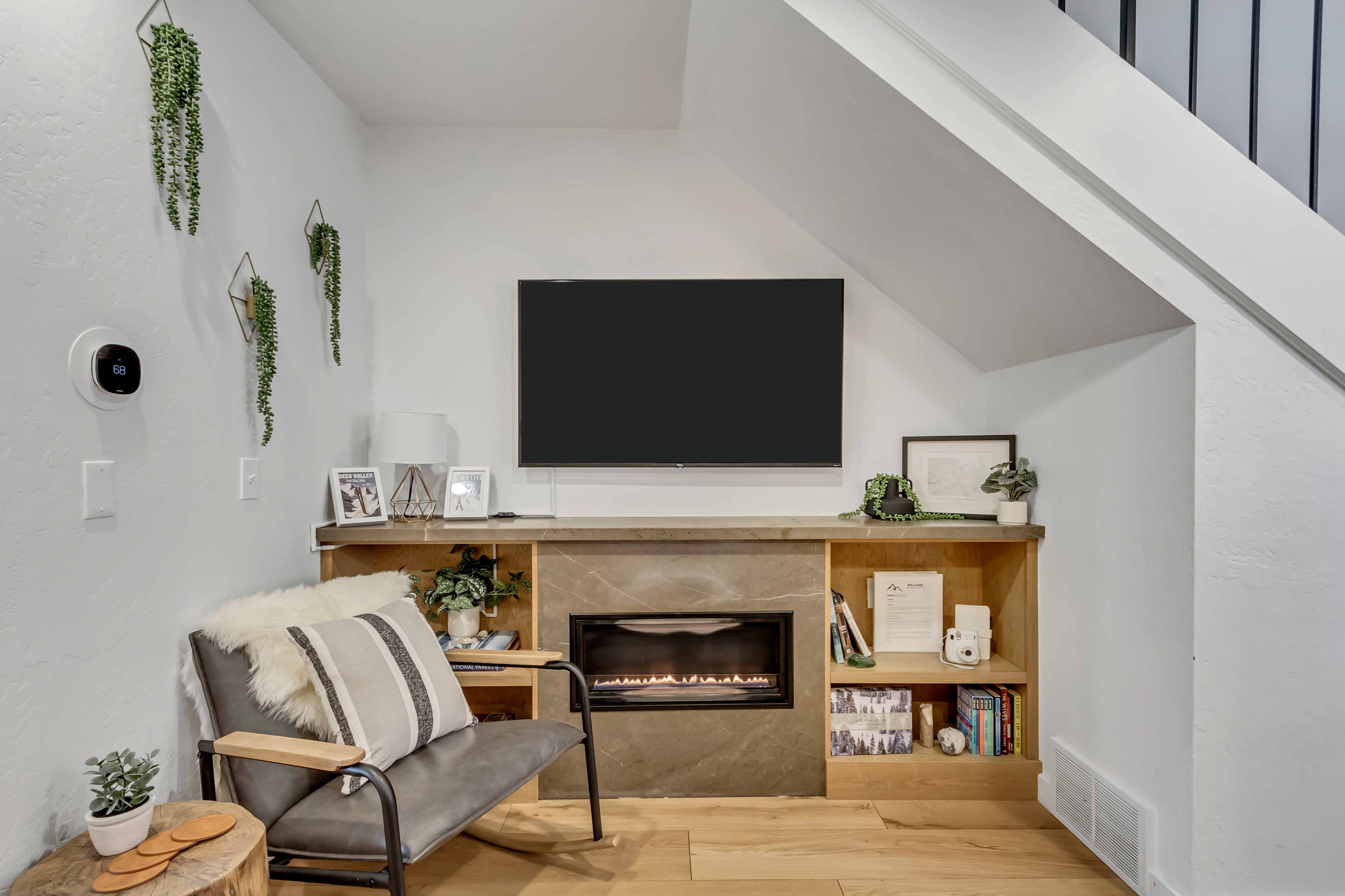 Living area featuring a premium fireplace and light wood-style floors