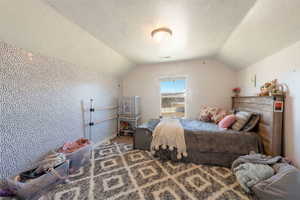 Bedroom featuring a textured ceiling