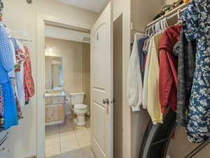 Walk in closet to ensuite bathroom