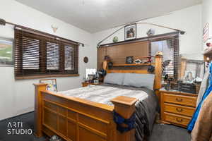 Bedroom with a textured ceiling