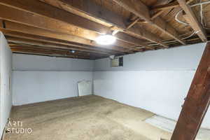 Unfinished below grade area with carpet floors