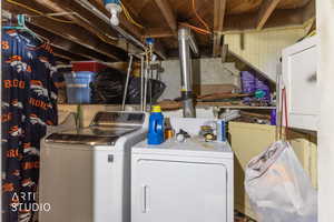Laundry area featuring washing machine and clothes dryer