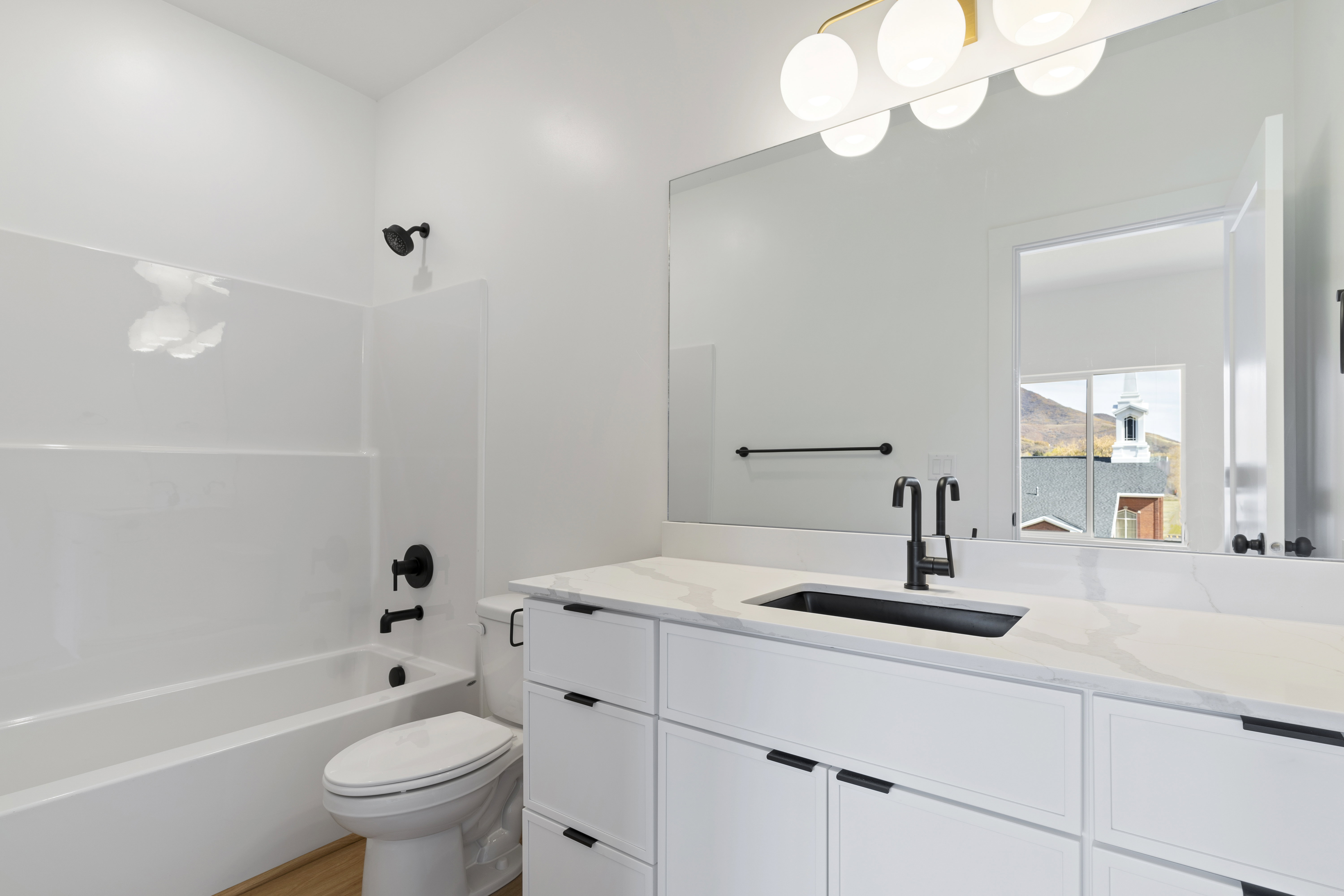Bathroom featuring vanity and shower / bath combination
