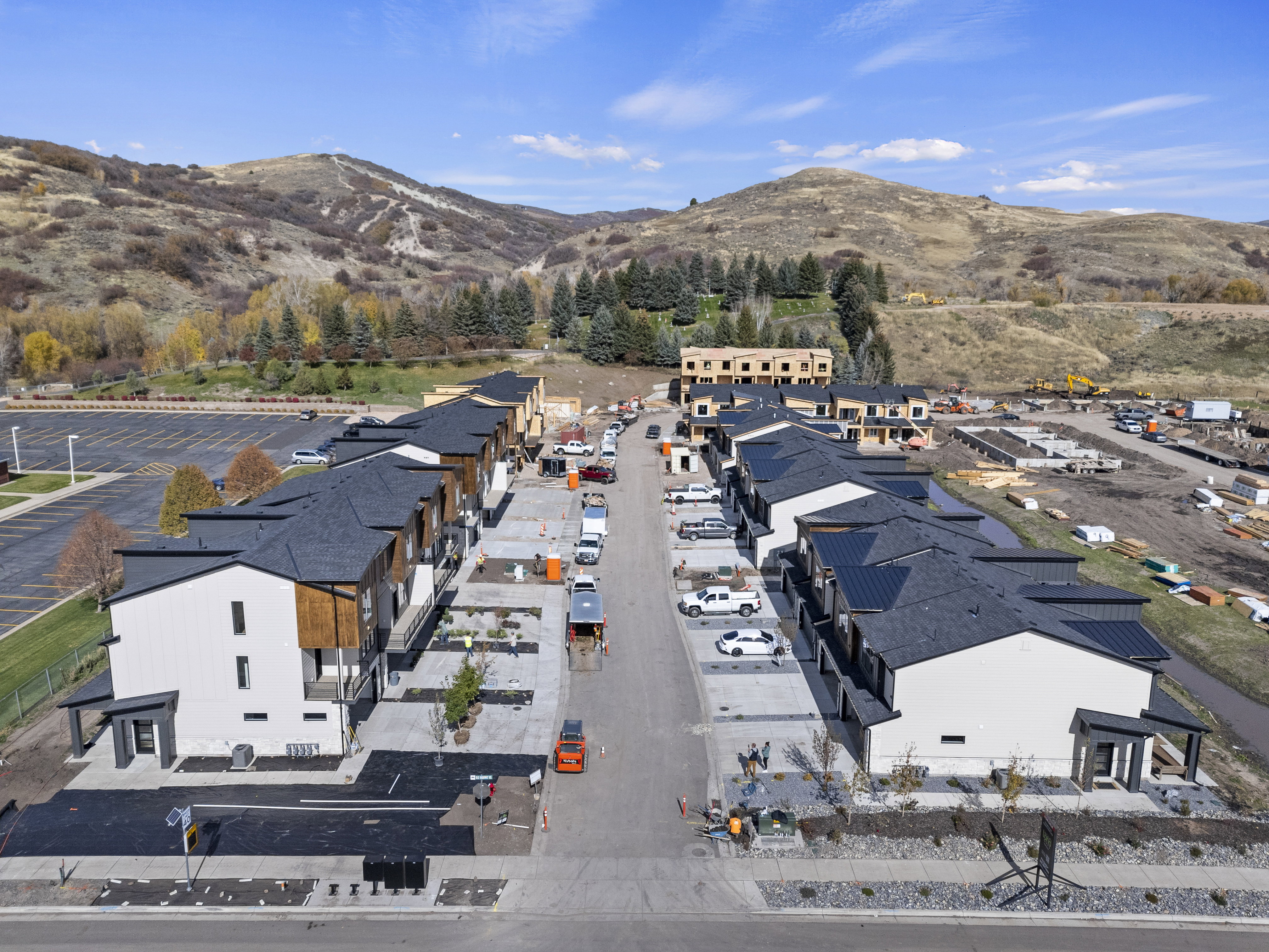 Aerial perspective of suburban area with a mountain backdrop