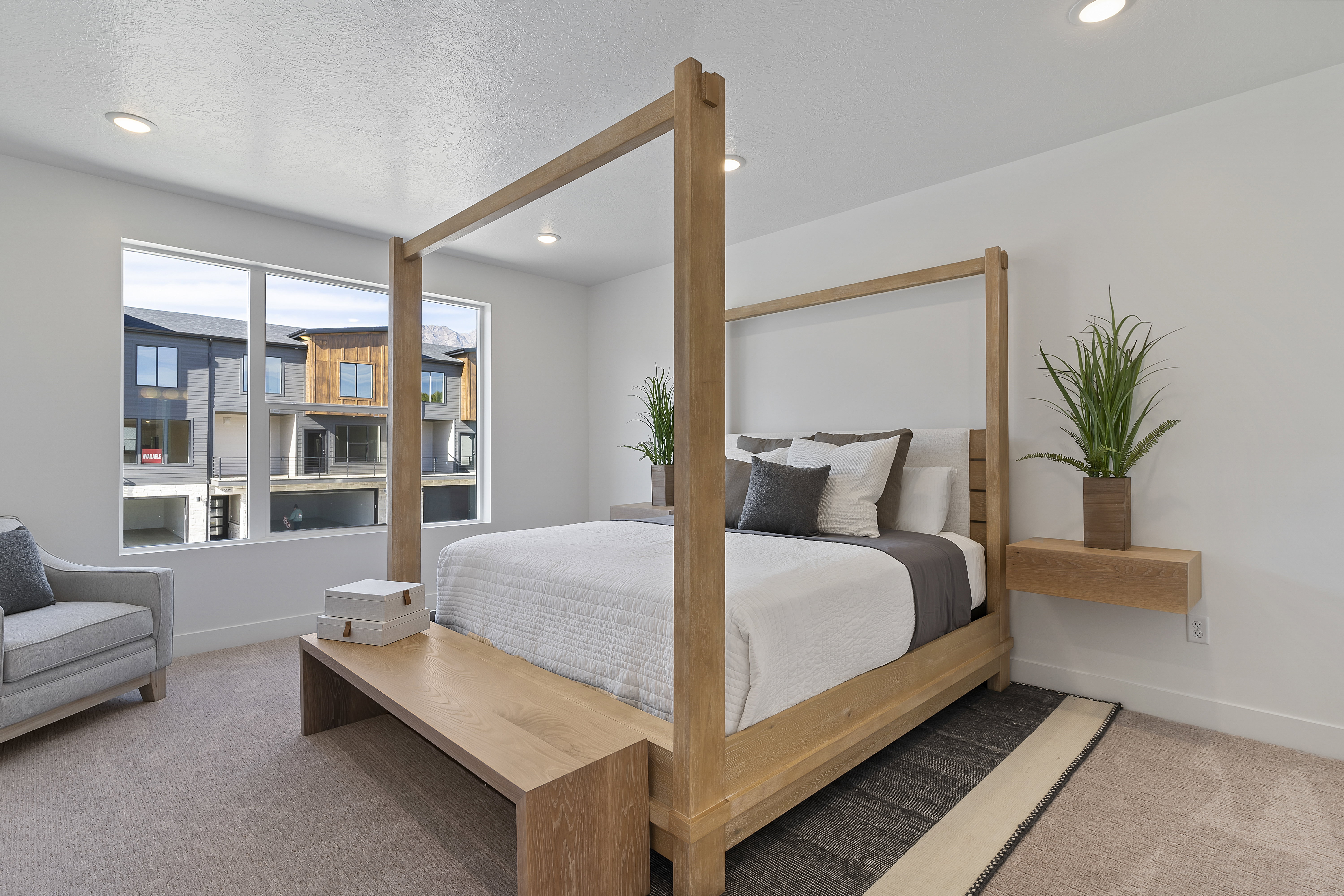 Carpeted bedroom with baseboards and recessed lighting