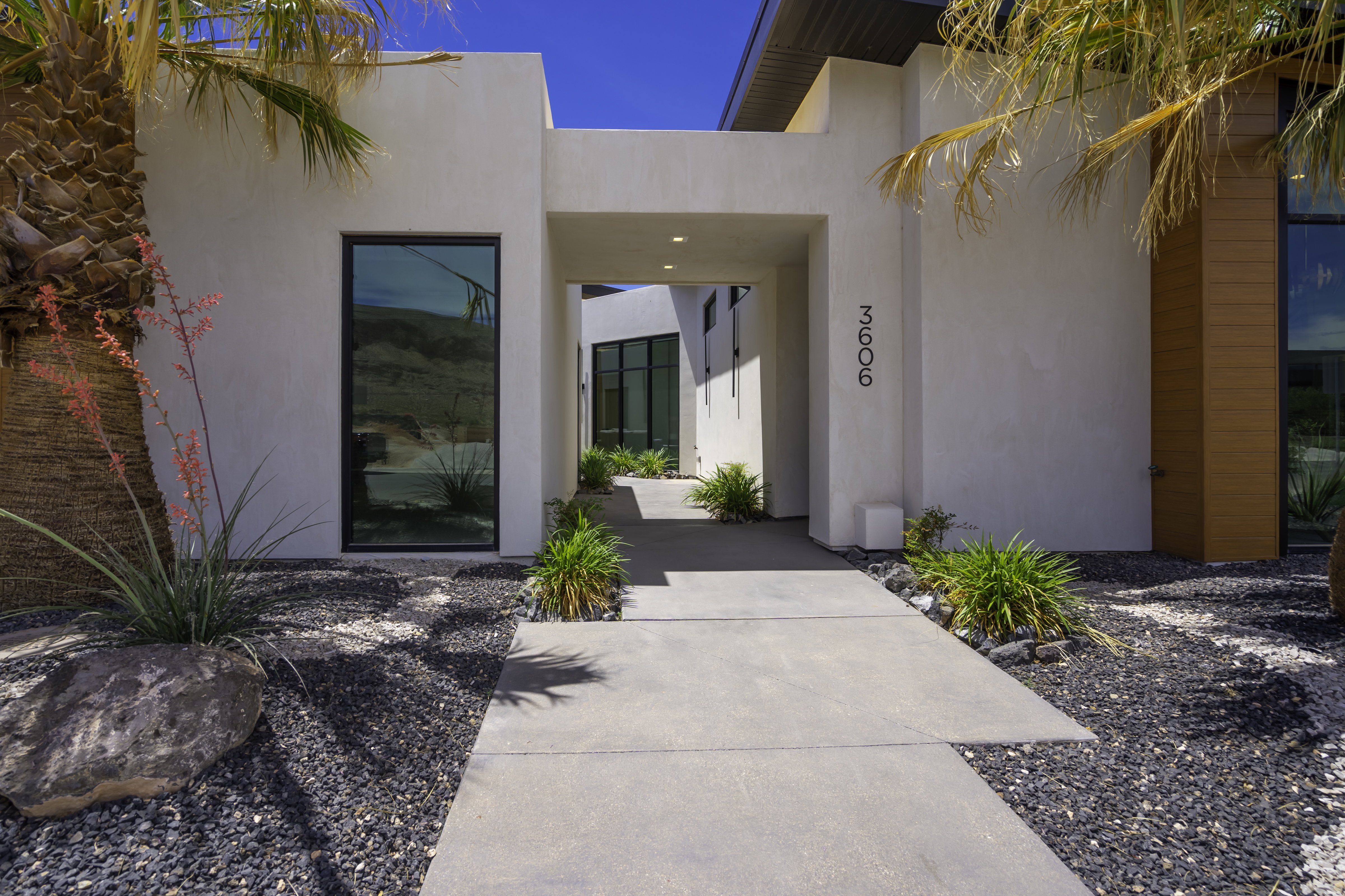 Doorway to property with stucco siding