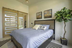 Bedroom featuring a barn door