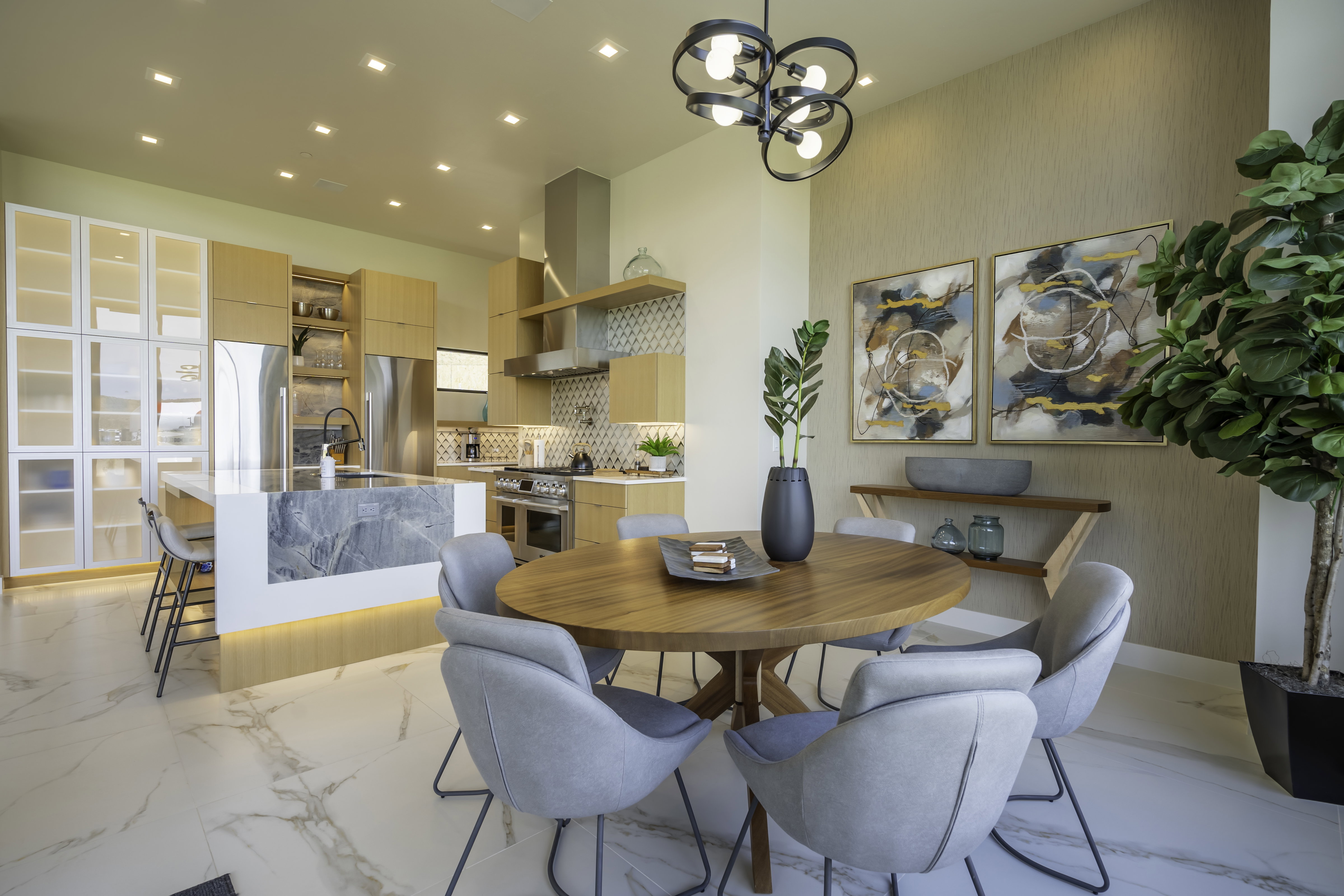 Dining room with hanging lights and light marble finish flooring