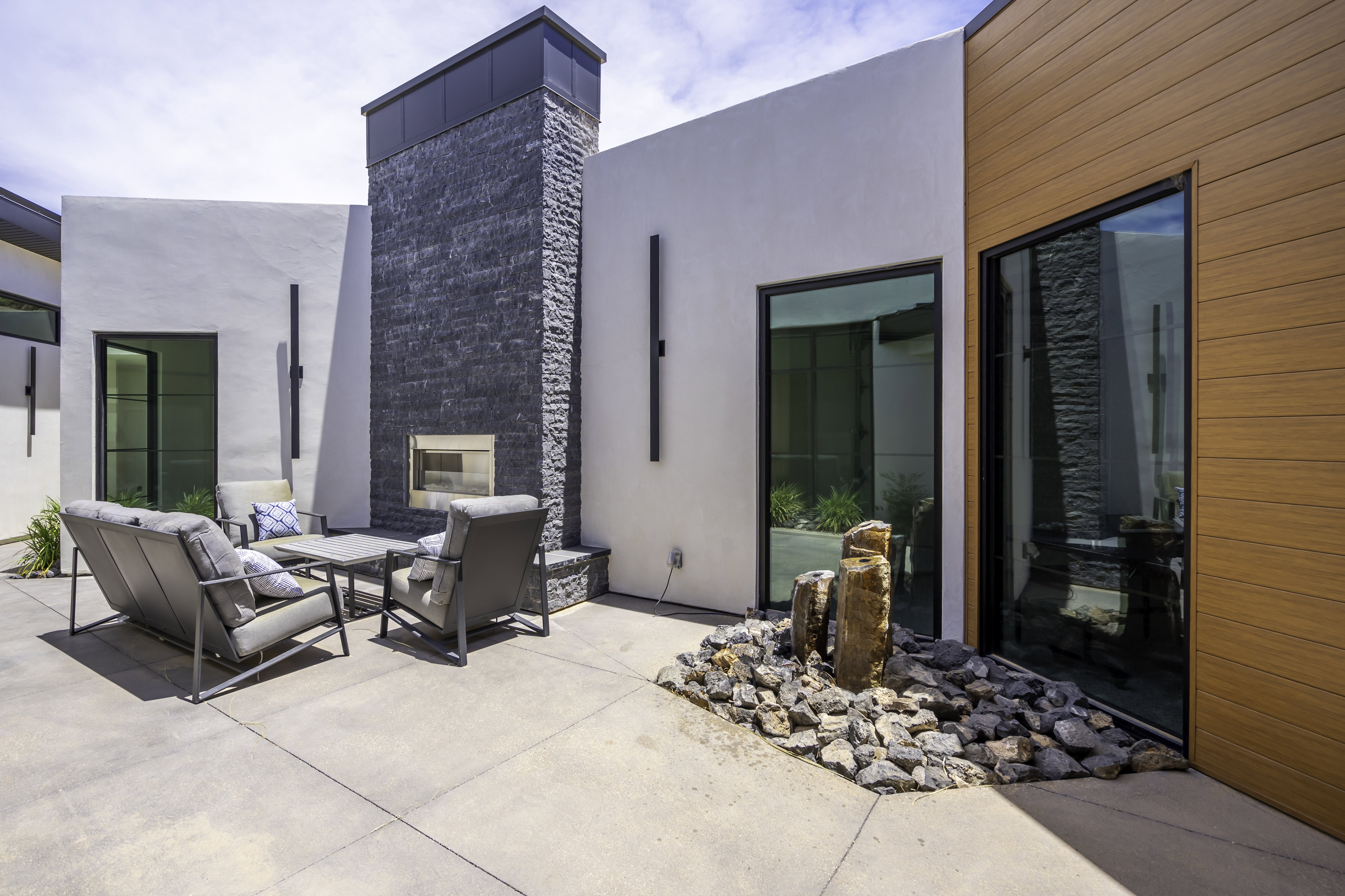 View of patio / terrace featuring an outdoor living space with a fireplace