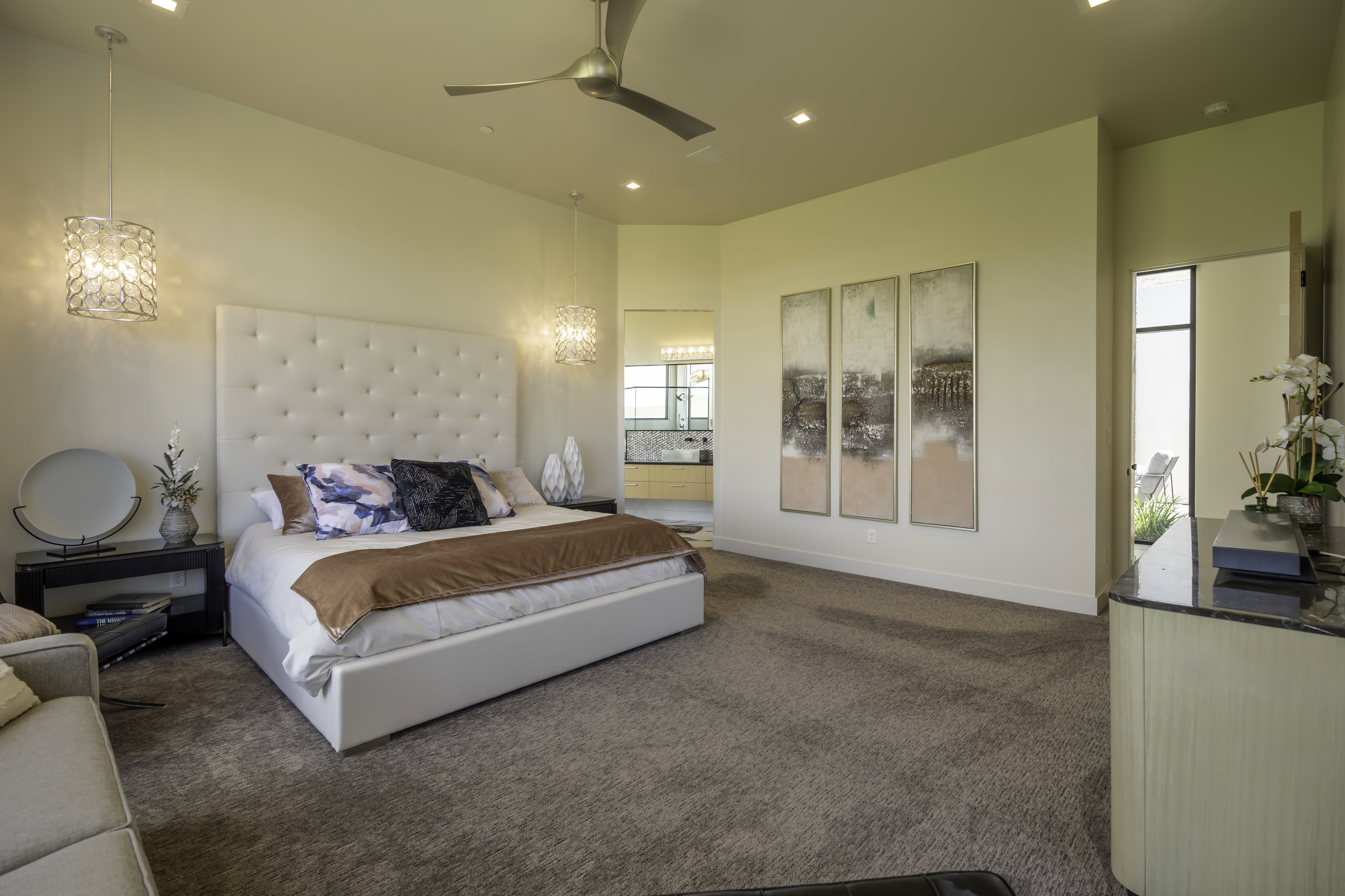 Bedroom featuring dark colored carpet, ceiling fan, recessed lighting, a high ceiling, and ensuite bath
