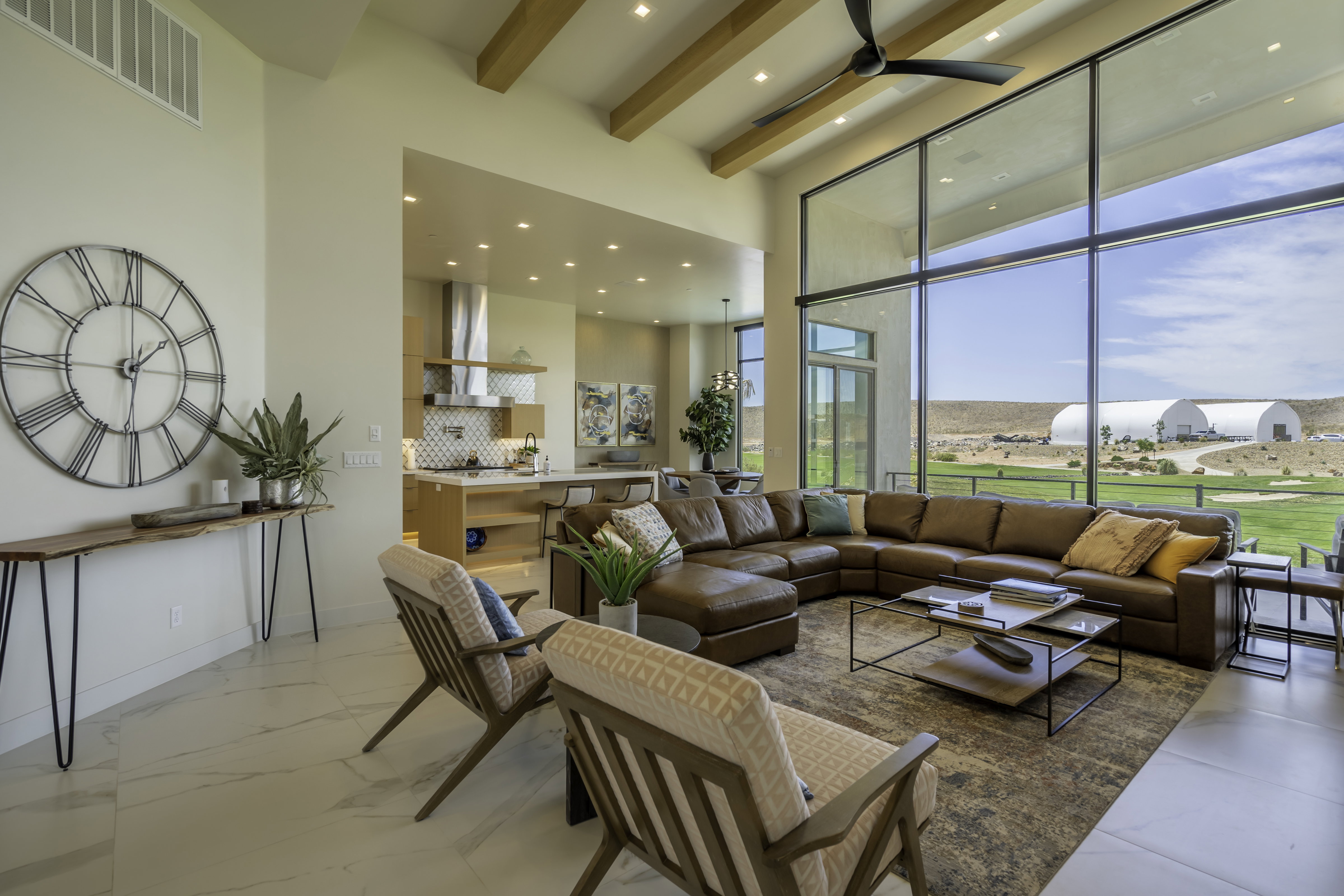 Living area featuring recessed lighting and a ceiling fan