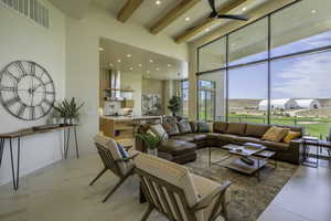 Living area featuring recessed lighting and a ceiling fan