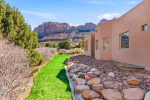 View of green lawn with a mountain view