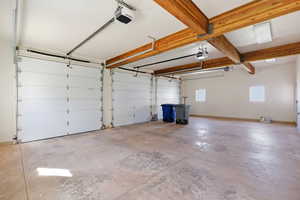 Garage featuring a garage door opener