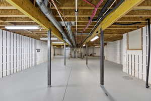 Unfinished below grade area with electric water heater