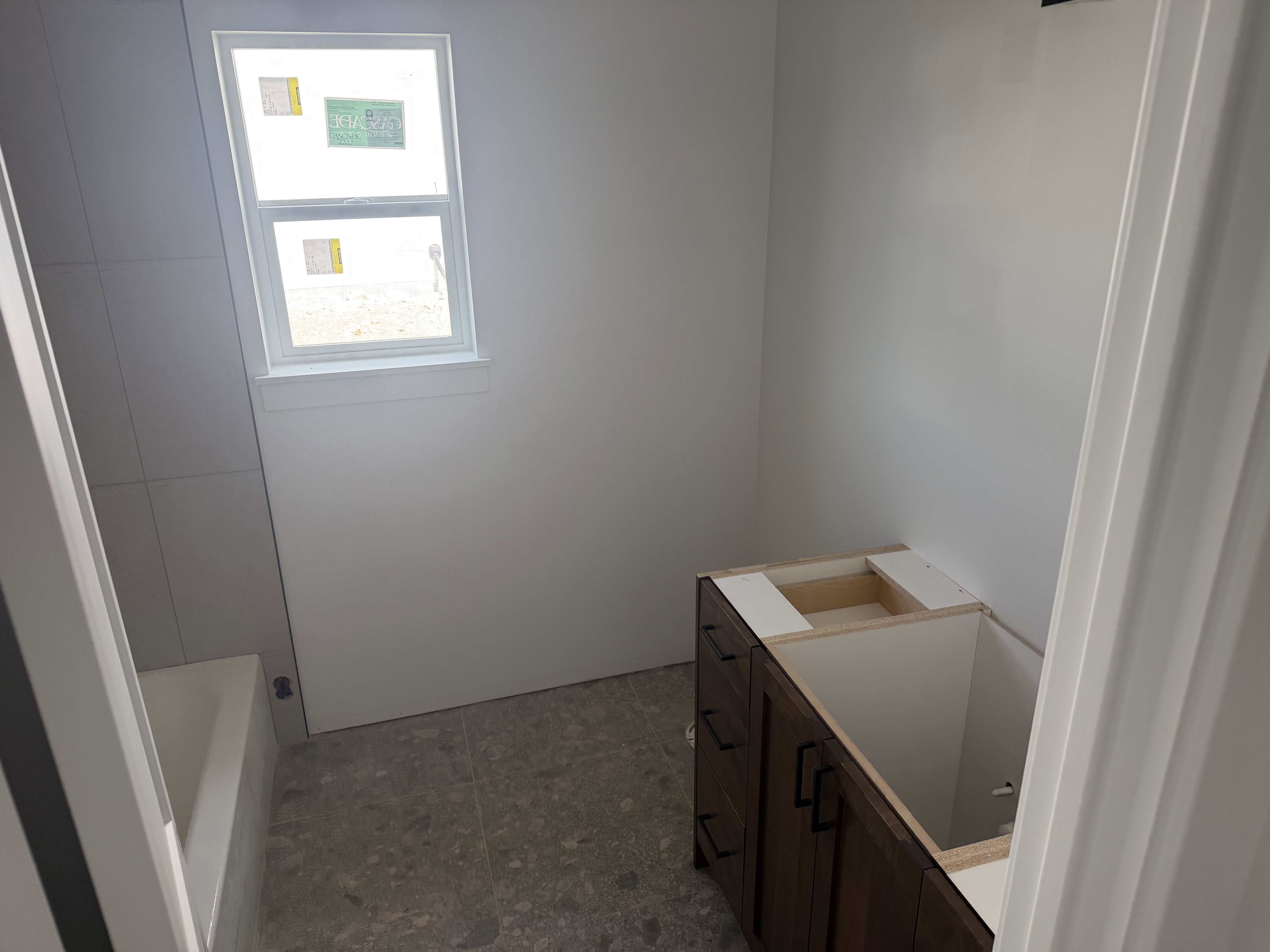 Full bathroom with vanity and a bathtub