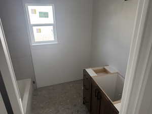 Full bathroom with vanity and a bathtub