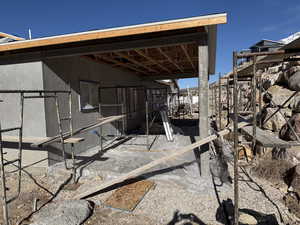 View of outbuilding with an exterior structure
