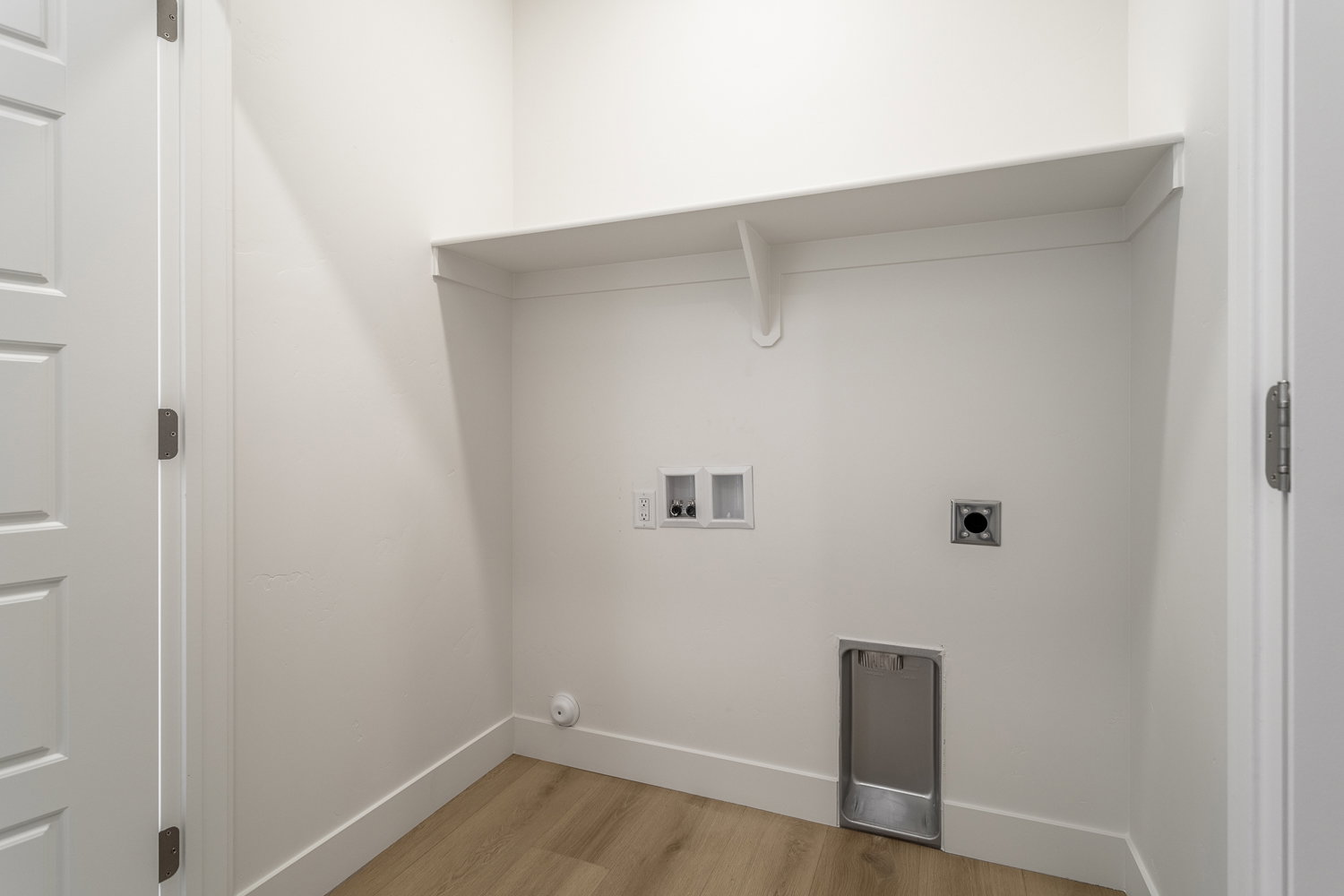 Laundry area featuring hookup for a washing machine, light wood-style floors, and hookup for an electric dryer