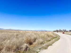 View of mountain backdrop with rural landscape