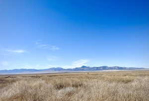 View of mountain background featuring rural landscape