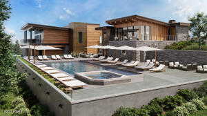 Community pool featuring an in-ground hot tub, a patio area, and a balcony