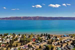 Aerial perspective of suburban area featuring a water and mountain view