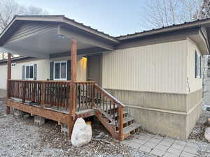 Rear view of property with a carport