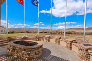 View of patio featuring a fire pit and a mountain view