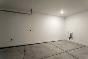 Garage featuring baseboards