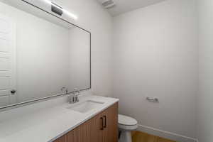 Bathroom featuring vanity and light wood-style flooring