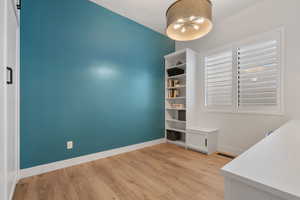 Bedroom 3 (Main Level) Built Ins make it a great secondary office, craft room, hobby room. Guest bedrooom...has its own murphy bed!!