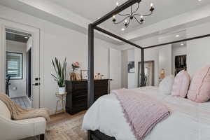 Main Level Primary Ensuite! Abundant windows. Access to upper deck. Can lights. Beautiful chandelier. Dual Sink Vanity. European style glass, oversized shower. Walk in closet (professional organizers).