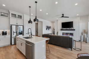 Quartz tops! Floor to ceiling cabinets. Pantry. Beautiful pendants. Under cabinet lighting. Stainless steel appliances. Gas range.