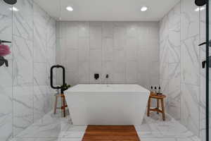 Lovely Spa/Resort Style Full Bath!! Multiple shower heads! Marble Tile! Relax after a long day or hitting it hard in the home gym!!!