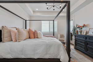 Main Level Primary Ensuite! Abundant windows. Access to upper deck. Can lights. Beautiful chandelier. Dual Sink Vanity. European style glass, oversized shower. Walk in closet (professional organizers).