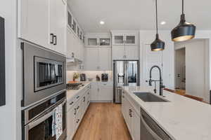 Quartz tops! Floor to ceiling cabinets. Pantry. Beautiful pendants. Under cabinet lighting. Stainless steel appliances. Gas range.