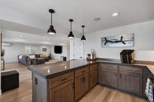 Tastefully Designed Wet Bar...with well thought out lighting. Entertainers dream area. Wine Chiller. Dishwasher.