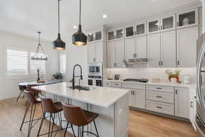 Quartz tops! Floor to ceiling cabinets. Pantry. Beautiful pendants. Under cabinet lighting. Stainless steel appliances. Gas range.