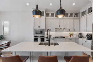 Quartz tops! Floor to ceiling cabinets. Pantry. Beautiful pendants. Under cabinet lighting. Stainless steel appliances. Gas range.