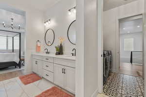 Main Level Primary Ensuite! Abundant windows. Access to upper deck. Can lights. Beautiful chandelier. Dual Sink Vanity. European style glass, oversized shower. Walk in closet (professional organizers).