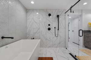 Lovely Spa/Resort Style Full Bath!! Multiple shower heads! Marble Tile! Relax after a long day or hitting it hard in the home gym!!!