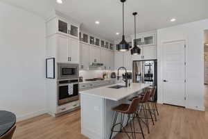 Quartz tops! Floor to ceiling cabinets. Pantry. Beautiful pendants. Under cabinet lighting. Stainless steel appliances. Gas range.