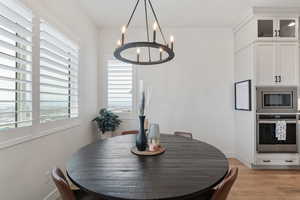 Quartz tops! Floor to ceiling cabinets. Pantry. Beautiful pendants. Under cabinet lighting. Stainless steel appliances. Gas range.